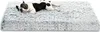A French bulldog lies on a fluffy gray dog bed. Produktbild-Vorschau