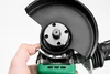 A close-up shot of an angle grinder being held by a person's hand. Anteprima dell’immagine prodotto