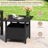 An outdoor side table with a drink and flowers on it, set in a garden or patio environment. Podgląd zdjęcia produktu