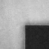 A close-up view of a rug, showing the texture of the pile and the patterned backing. Anteprima dell’immagine prodotto