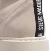 A close-up view of the heel of a beige boot with a black stripe featuring white text. Produktbild-Vorschau