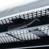 A close-up view of the underside of an ironing board, showing the metal frame and a black handle. Náhľad obrázku produktu