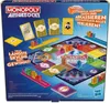 The image shows the back of a Monopoly Ausgezockt board game box, displaying the game board, cards, dice, and game pieces. Produktbild-Vorschau