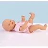 A baby doll lying on its back. Produktbild-Vorschau