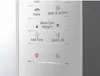A close-up view of a microwave control panel with various function buttons and icons. Voir les images du produit