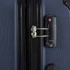 A close-up view of a dark blue suitcase zipper and TSA lock. Produktbild-Vorschau