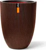 A close-up studio shot of a decorative planter. Produktbild-Vorschau