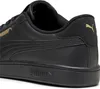 A close-up view of the heel and side of a black Puma sneaker with gold accents. Podgląd zdjęcia produktu