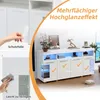 A white sideboard with LED lighting and decorative elements, shown with a hand peeling off protective film and another hand cleaning it. Podgląd zdjęcia produktu