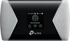 A TP-Link mobile hotspot device is shown from the front, displaying its screen with network information. Produktbild-Vorschau