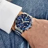 A person wearing a watch on their wrist, with a white shirt sleeve and blue denim jeans visible. Produktbild-Vorschau
