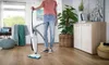 A person is holding a steam mop in a living room. Anteprima dell’immagine prodotto