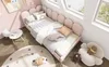 A child's bedroom with a pink bed, toys, and a rug. Podgląd zdjęcia produktu