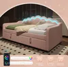 A pink upholstered daybed with LED lighting on the headboard, shown in a bedroom setting with a rug and a phone app interface at the bottom. Produktbild-Vorschau