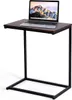 A laptop is placed on a C-shaped side table. Náhled obrázku produktu