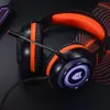 A close-up shot of a gaming headset with orange accents and illuminated earcups. Voir les images du produit