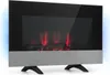 A modern electric fireplace with a black glass front and a brushed metal base, standing on black legs. The fireplace displays a simulated flame effect in red and has blue ambient lighting on the sides. Náhľad obrázku produktu