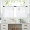 A kitchen counter with a window and sheer curtains above it, decorated with personal items. Náhľad obrázku produktu