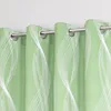 Close-up view of green curtains with a white wavy pattern hanging on a silver curtain rod against a light gray wall. Produktbild-Vorschau