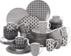 A collection of ceramic dinnerware with a geometric pattern. Náhled obrázku produktu