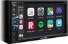 A close-up of an Alpine car stereo system displaying a smartphone interface with various app icons. Produktbild-Vorschau