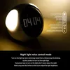 A digital alarm clock with glowing lights and a digital display showing the time. Produktbild-Vorschau