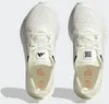 A top-down view of two white Adidas Ultraboost running shoes. Podgląd zdjęcia produktu