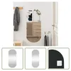 A hallway with a mirror, cabinet, coat rack, and umbrella stand. Náhľad obrázku produktu