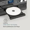 A close-up of a CD player with a CD inserted, showing the control panel and display. Produktbild-Vorschau