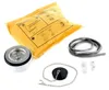 A collection of plumbing parts, including a sink drain, a rubber seal, a drain plug with a chain, and a yellow instruction packet, arranged on a white background. Náhled obrázku produktu