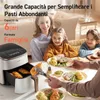 A family gathered around a table, with a prominent air fryer in the foreground, showcasing food being served. Náhľad obrázku produktu
