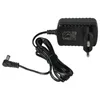 A black power adapter with a coiled cord and a right-angle connector is shown against a white background. Produktbild-Vorschau