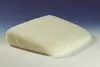 A cream-colored, fluffy seat cushion is shown on a gradient blue and white background. Produktbild-Vorschau