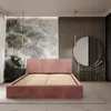 A bedroom with a pink upholstered bed, a dresser with flowers, a round mirror, and decorative wall paneling. Produktbild-Vorschau