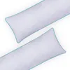 Two white body pillows with teal piping are shown diagonally on a white background. Anteprima dell’immagine prodotto