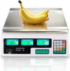 A digital scale with bananas on top, displaying weight, unit price, and total price. Voir les images du produit