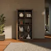 A bookshelf filled with decorative items and books in a room setting. Produktbild-Vorschau