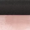The image shows the underside of a pink rug with a black backing covered in white dots. Produktbild-Vorschau