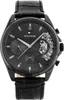 A close-up studio shot of a black Tommy Hilfiger men's watch with a black leather strap. Produktbild-Vorschau