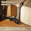 A person is holding the handle of a vacuum cleaner that is bent to clean under a cabinet. Produktbild-Vorschau