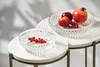 Two glass bowls filled with fruit sit on marble-topped tables. Podgląd zdjęcia produktu