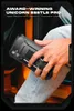 A person is holding a black phone case with a kickstand. Produktbild-Vorschau
