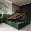 A bedroom with a green upholstered bed frame, its storage compartment open, revealing the slatted base. The room features a mural on one wall and wooden paneling on another. Náhled obrázku produktu