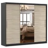 A sliding door wardrobe with mirrored panels, reflecting a bedroom interior. Produktbild-Vorschau