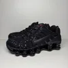 A pair of black Nike Shox TL sneakers are displayed against a plain light gray background. Produktbild-Vorschau