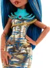 Close-up of a doll's torso and head, showing its dress, necklace, and hair. Anteprima dell’immagine prodotto