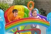 Two children are playing on a colorful inflatable trampoline with a rainbow design. Voir les images du produit