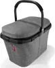A gray Reisenthel carrybag iso shopping basket with a black handle and lid, shown from a slightly elevated side angle on a white background. Produktbild-Vorschau