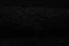 A close-up view of a black shaggy carpet. Anteprima dell’immagine prodotto