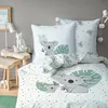 A bedroom scene with bedding featuring koala illustrations. Produktbild-Vorschau